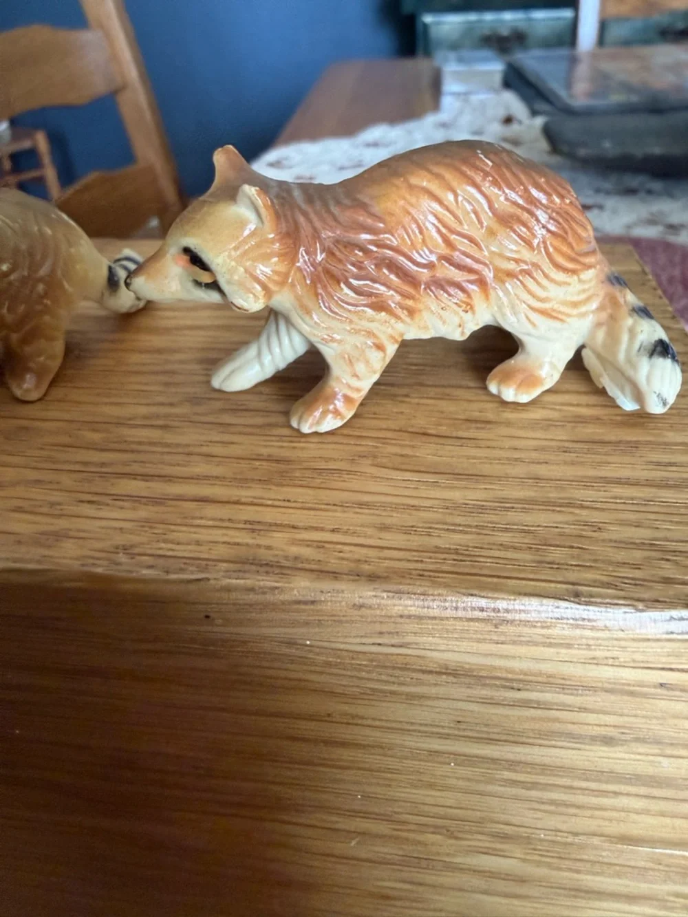 Mini pair of raccoon figurines